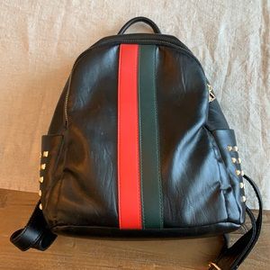 Black backpack/purse. In good condition.